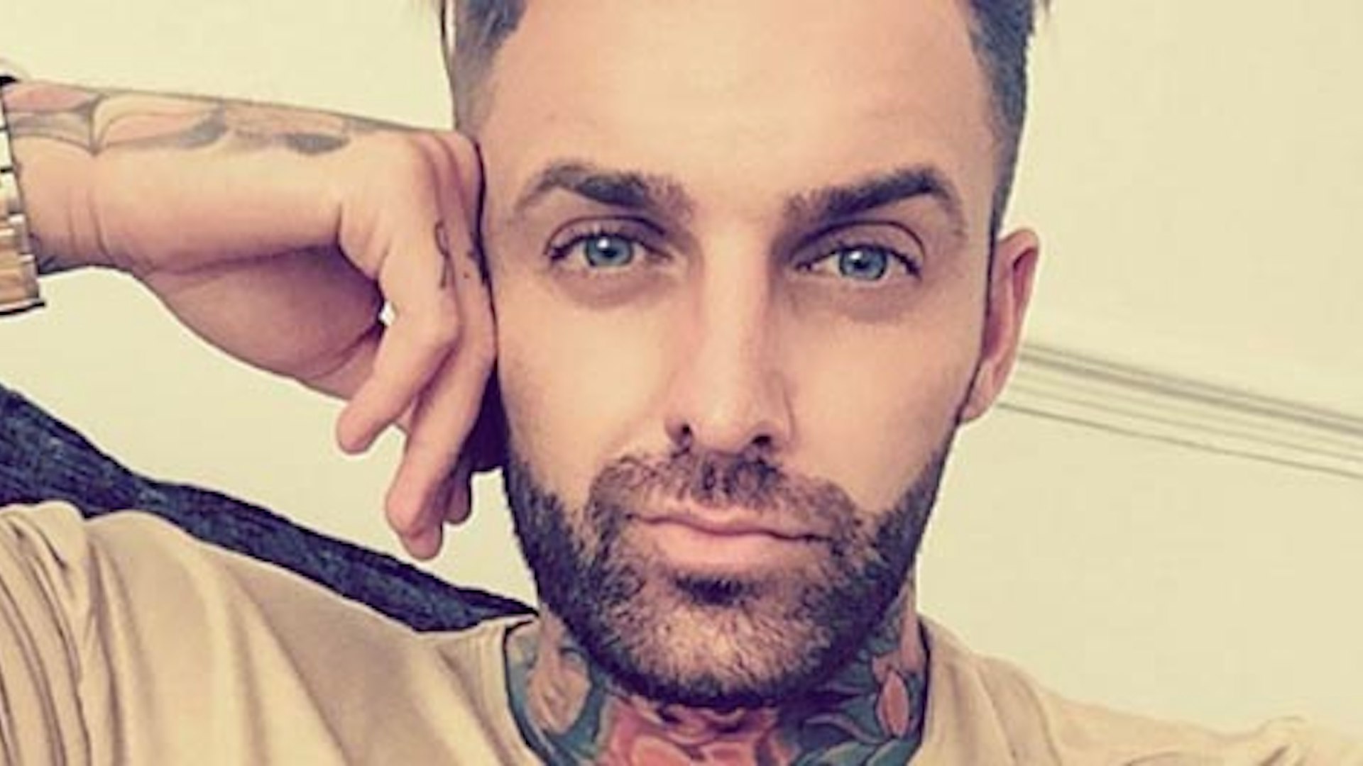 Aaron Chalmers tattoos: Separate Heat photograph showing the tattooed neck and upper-body context