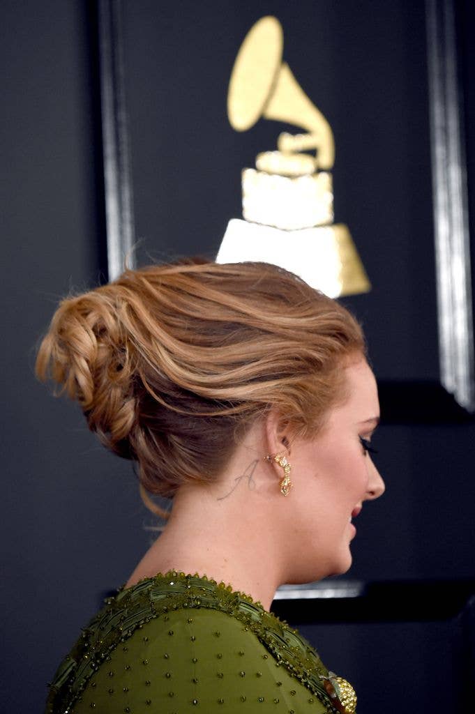 Adele Angelo neck tattoo