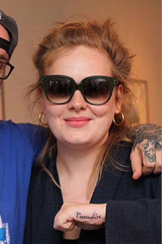 Adele Paradise hand tattoo close-up
