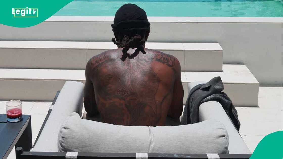 Ademola Lookman tattoos: Genuine tattoo evidence showing the upper-back design