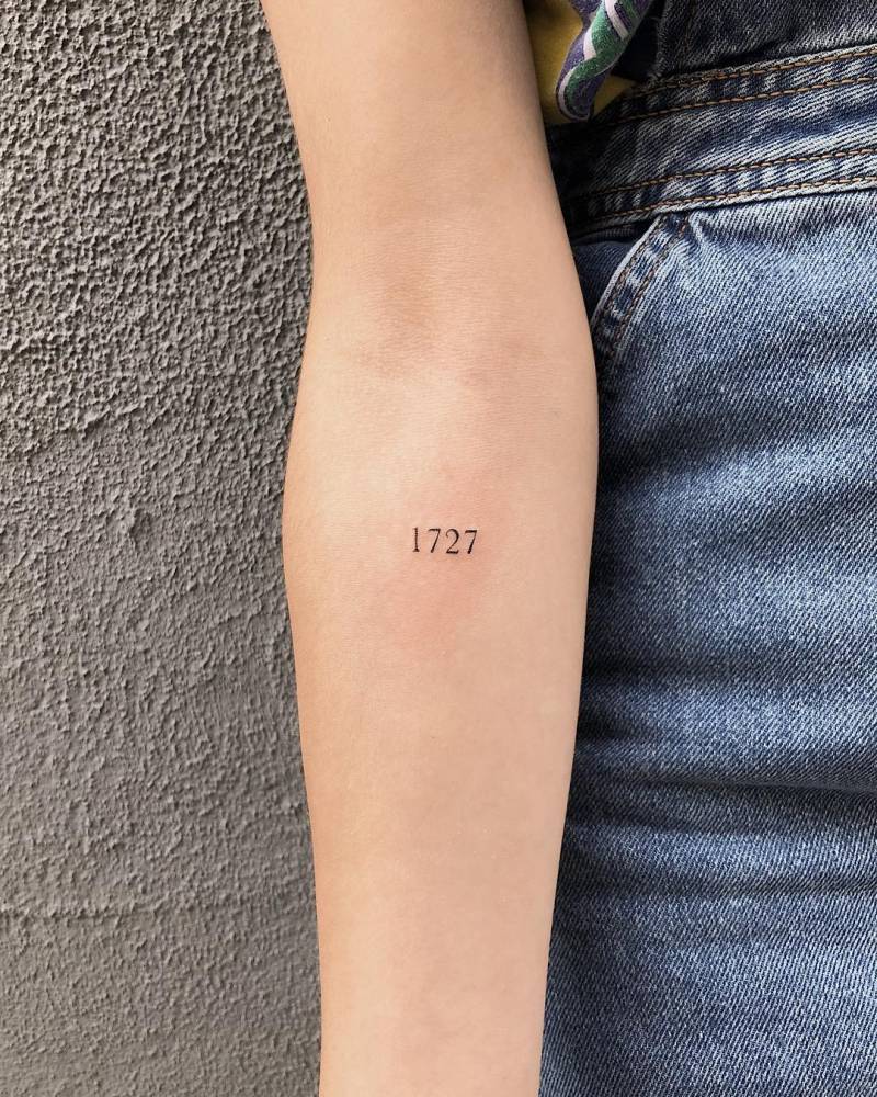 Aitana Ocaña tattoos: distinct close-up of the 1727 forearm tattoo for design discussion