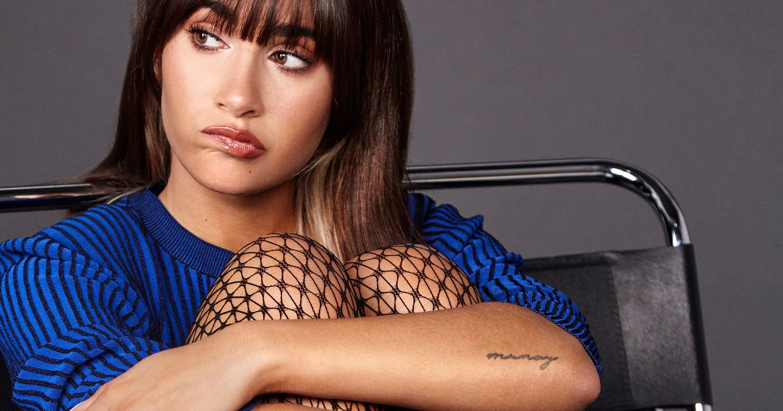 Aitana Ocaña tattoos: Munay forearm lettering