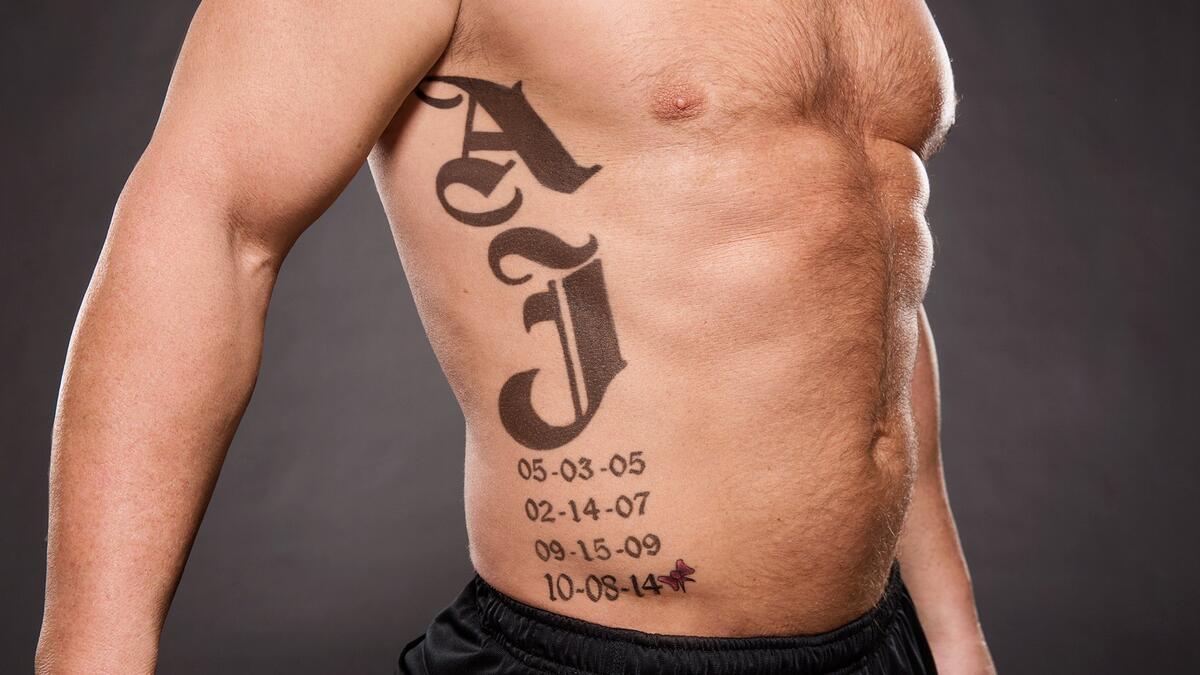 AJ Styles tattoos: inline view of the four family dates