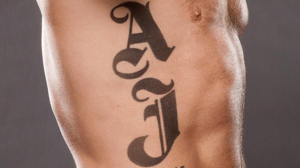 AJ Styles tattoos: inline side angle showing rib placement
