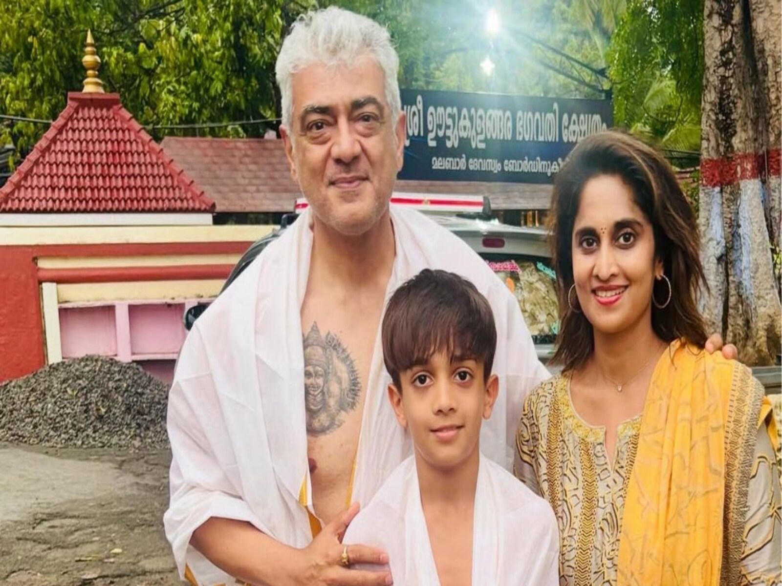 Ajith Kumar tattoos: separate close family crop with the chest figure more prominent and arm area in frame