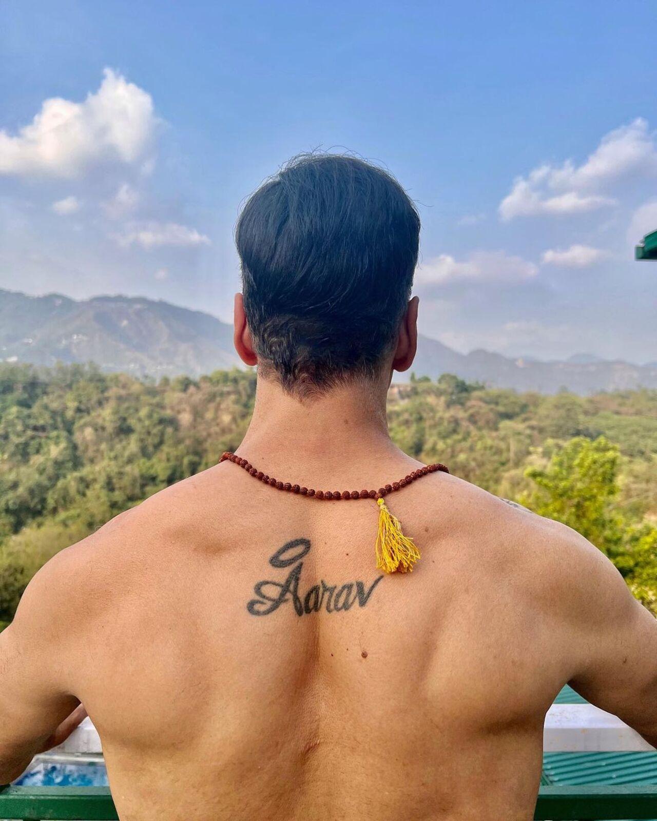 Aarav upper-back tattoo photograph from Mid-Day Akshay Kumar tattoos: Aarav upper-back tattoo photograph from Mid-Day