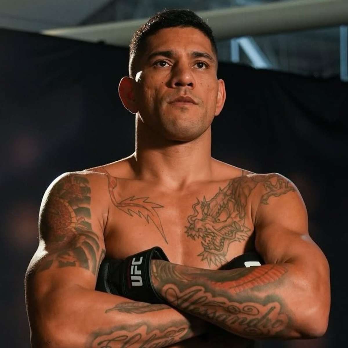 Alex Pereira chest and forearm tattoos in a UFC portrait