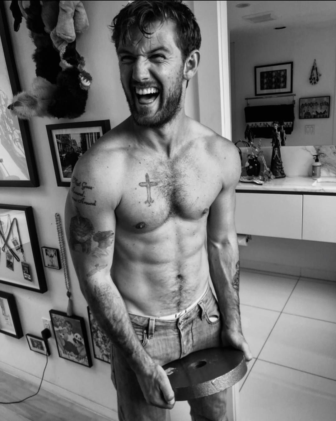 Alex Pettyfer multiple tattoos torso and arms