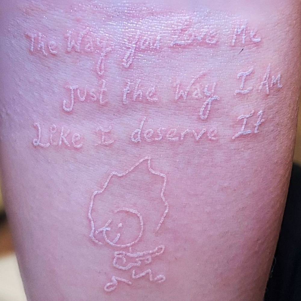 Alexa Bliss white ink handwriting lyrics forearm tattoo