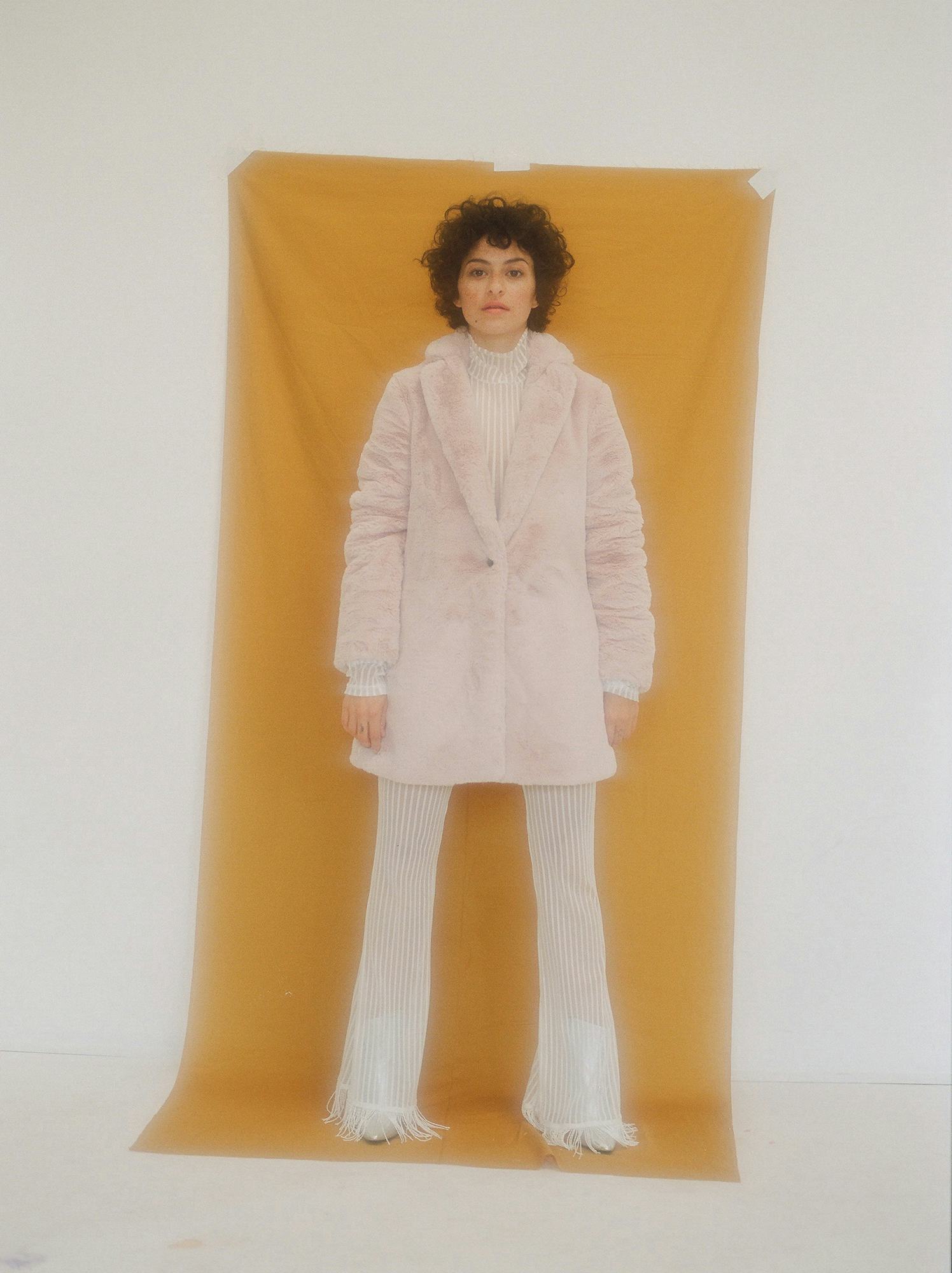 Alia Shawkat in a contextual photograph: contextual photograph for the actor and creative-life section; not tattoo evidence; not tattoo evidence
