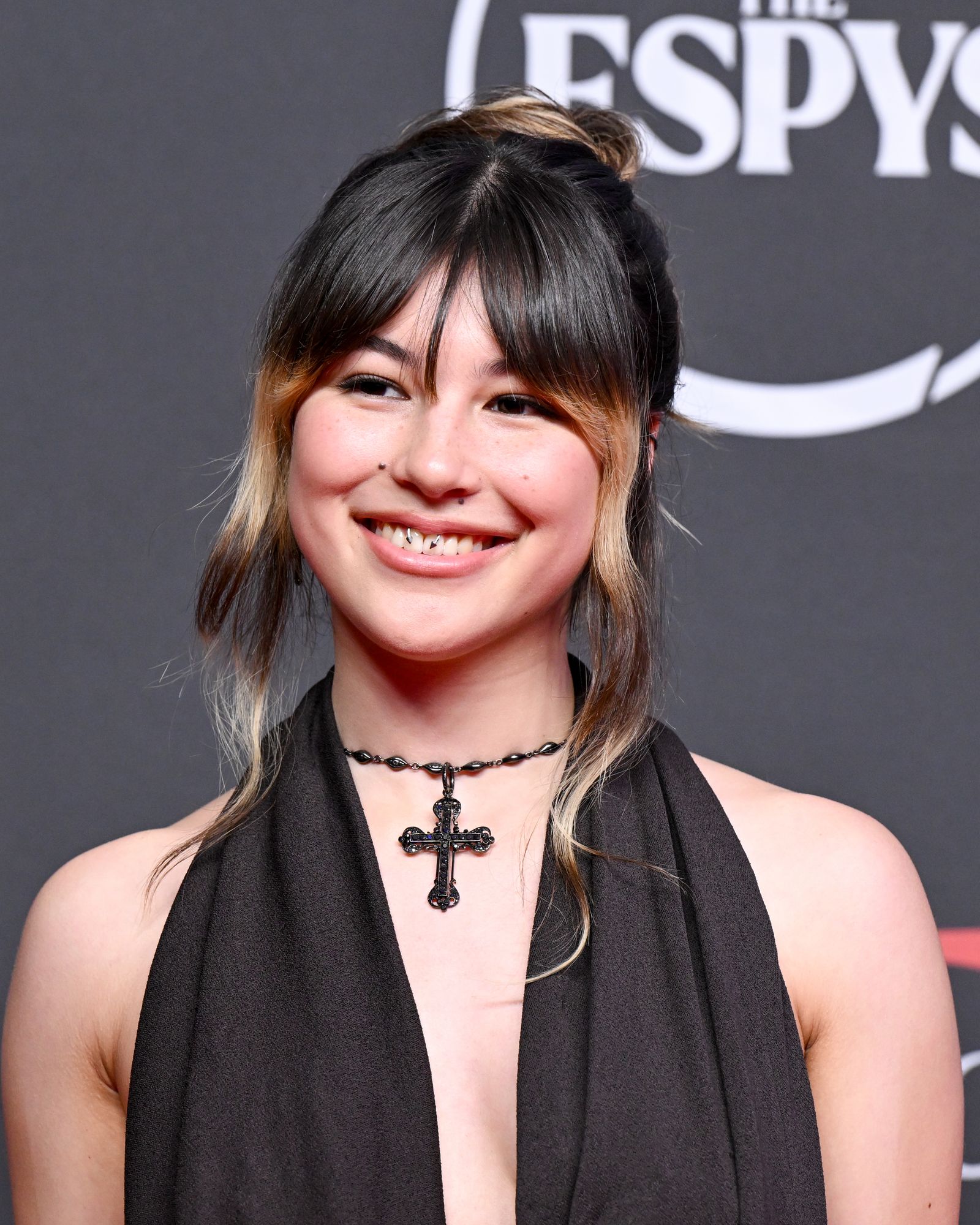 Alysa Liu in a contextual photograph: Contextual face-forward ESPYs portrait; not showing tattoo evidence; not tattoo evidence
