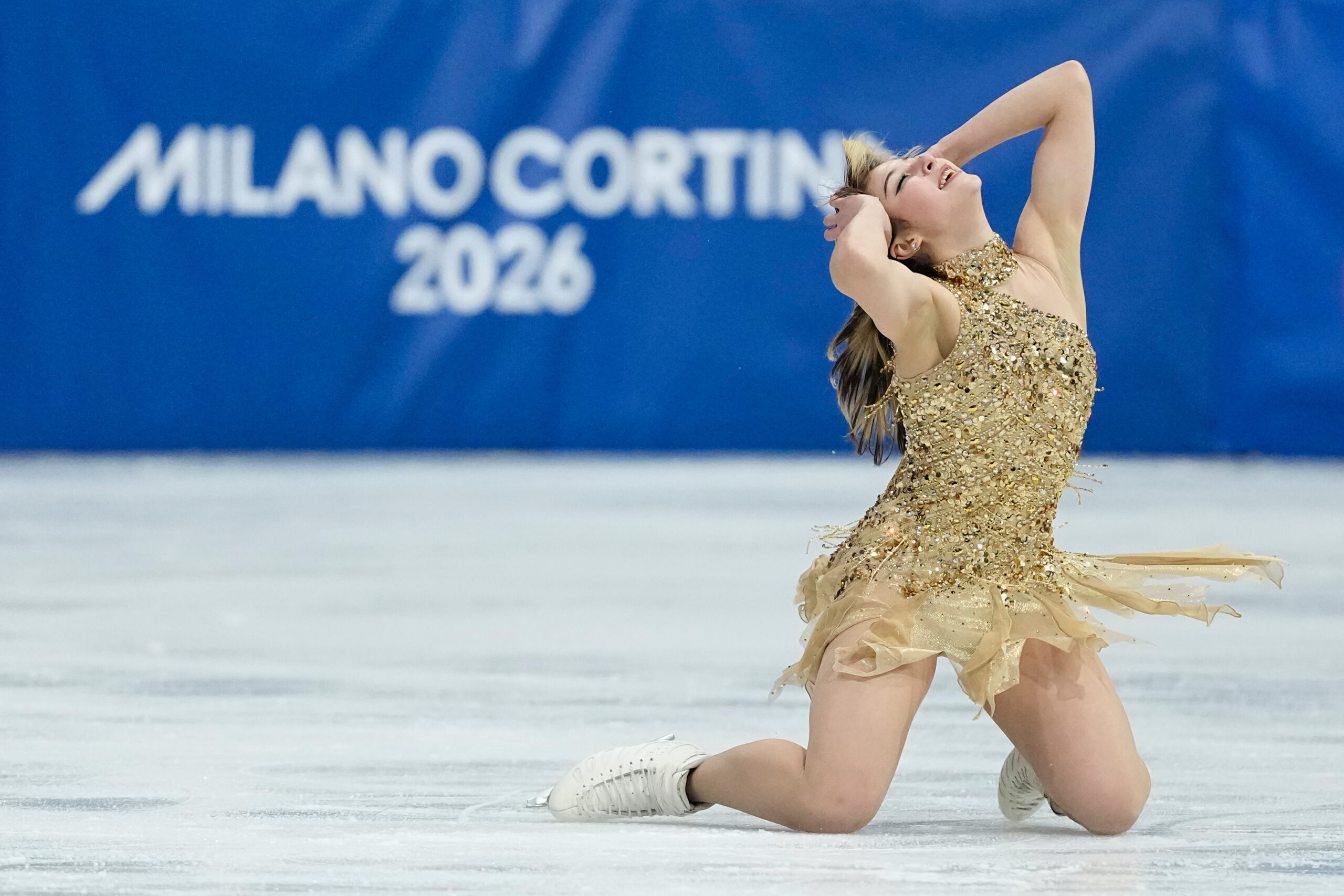 Alysa Liu in a contextual photograph: Contextual free-skate photograph; not showing tattoo evidence; not tattoo evidence