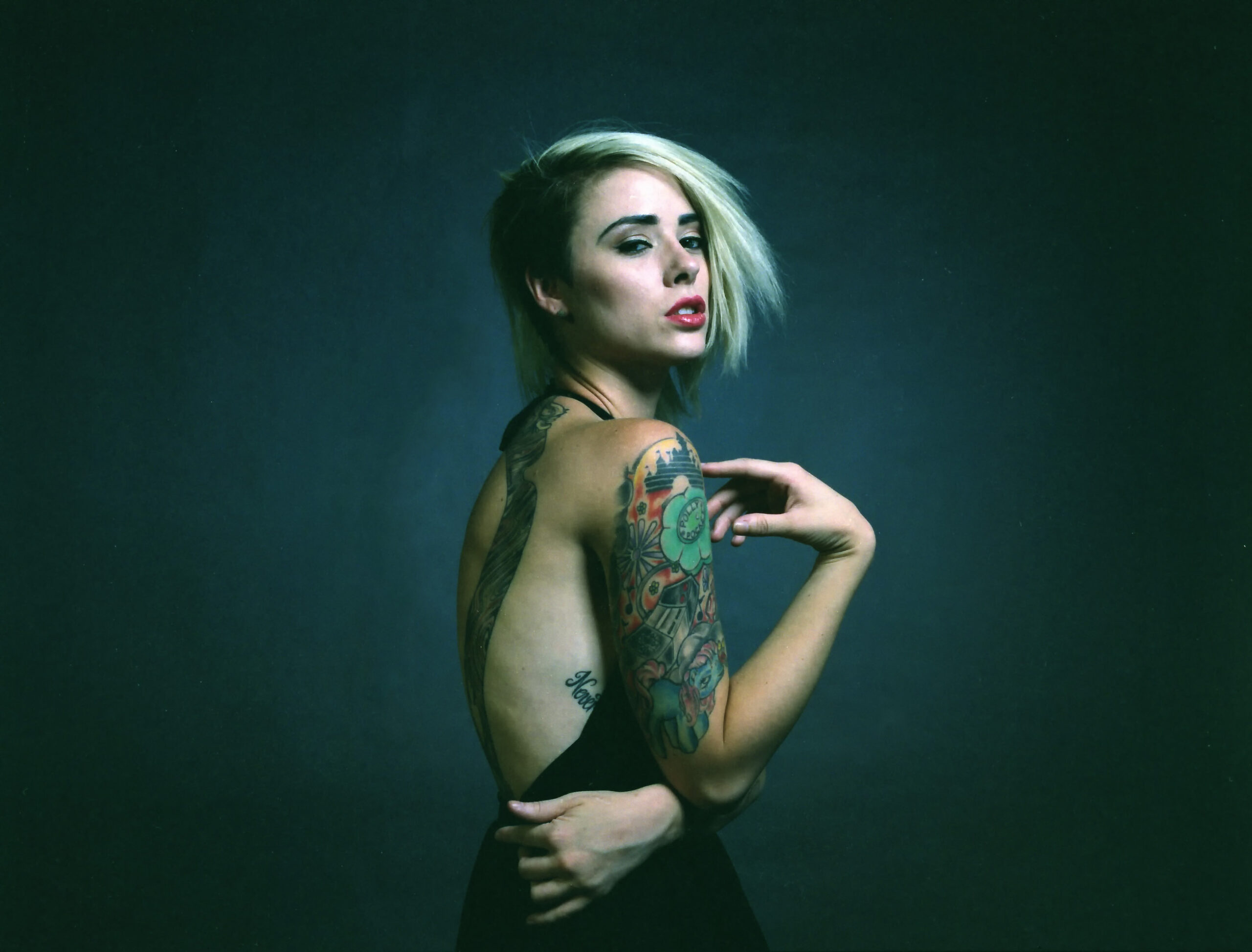 Alysha Nett shoulder and back tattoo layout Alysha Nett tattoos: large full-back and shoulder portrait showing the colorful shoulder work and the way the collection sits across a broad canvas