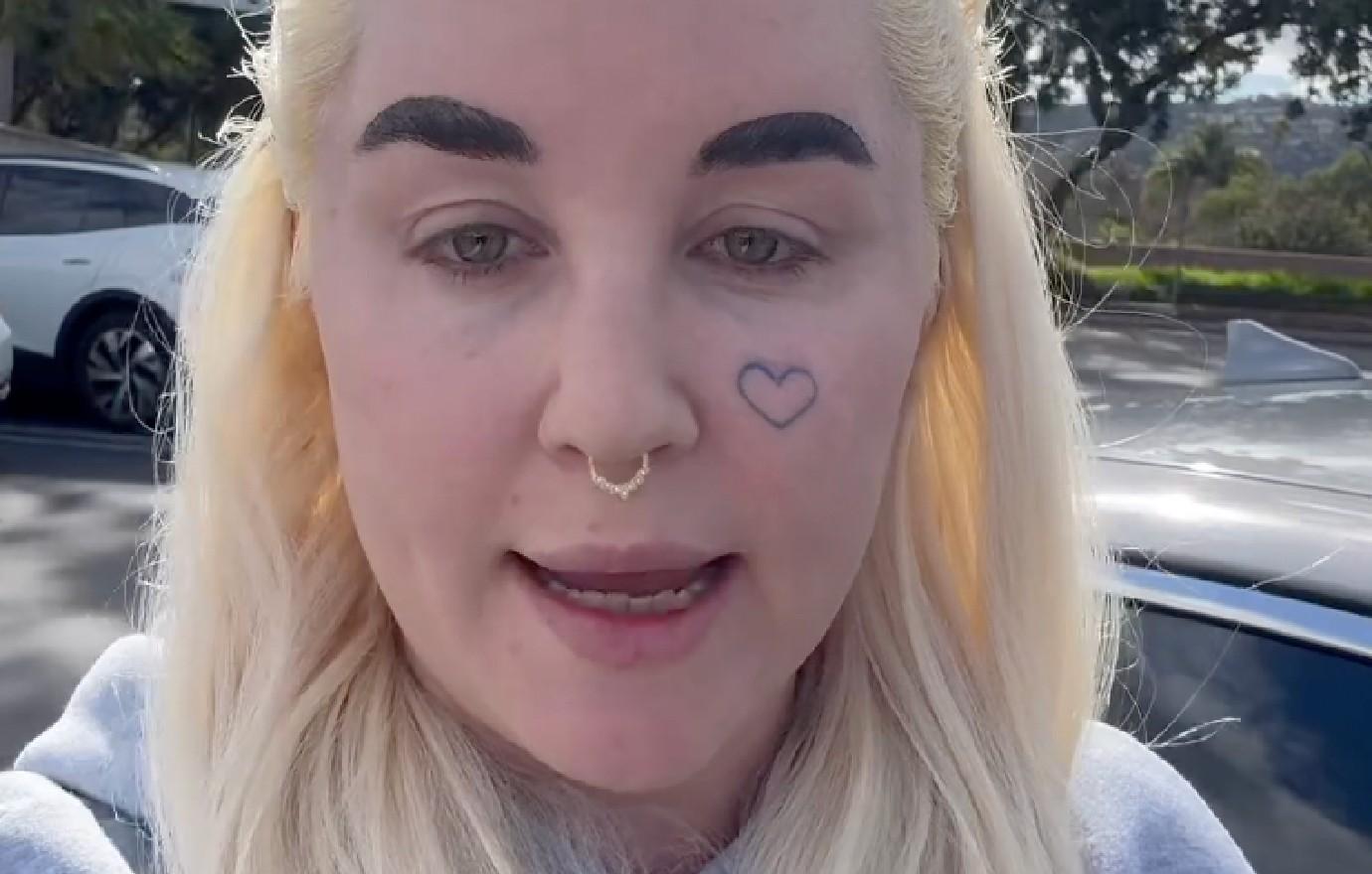Amanda Bynes tattoos: A separate outdoor view of the cheek-heart design