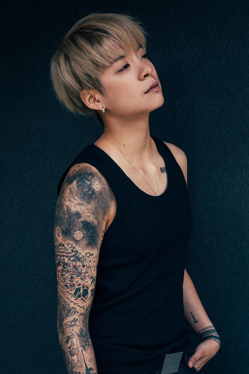 Amber Liu tattoos: separate full-arm portrait for the lower-arm and knee details section