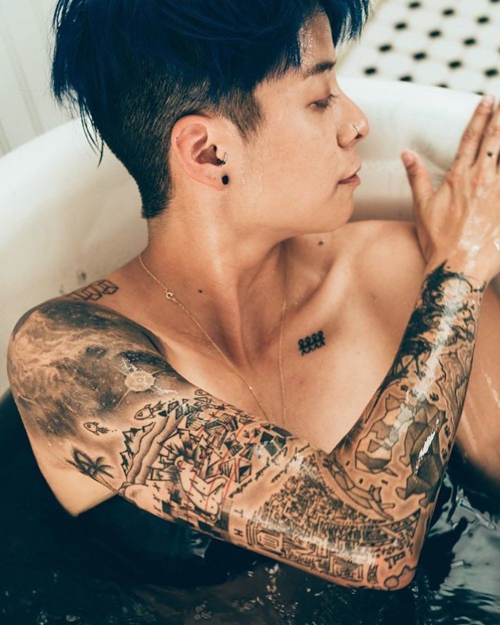 Amber Liu tattoos: full arm and shoulder coverage in the widest tattoo photograph