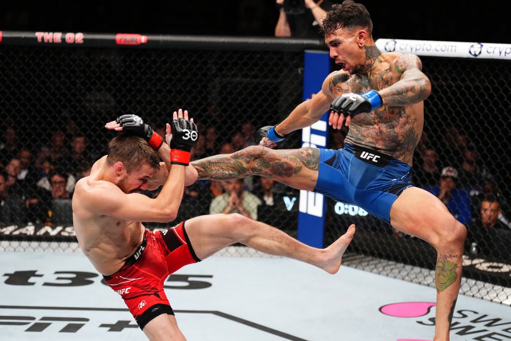 Andre Fili The leg tattoos in a kicking stance Andre Fili tattoos: The leg tattoos in a kicking stance