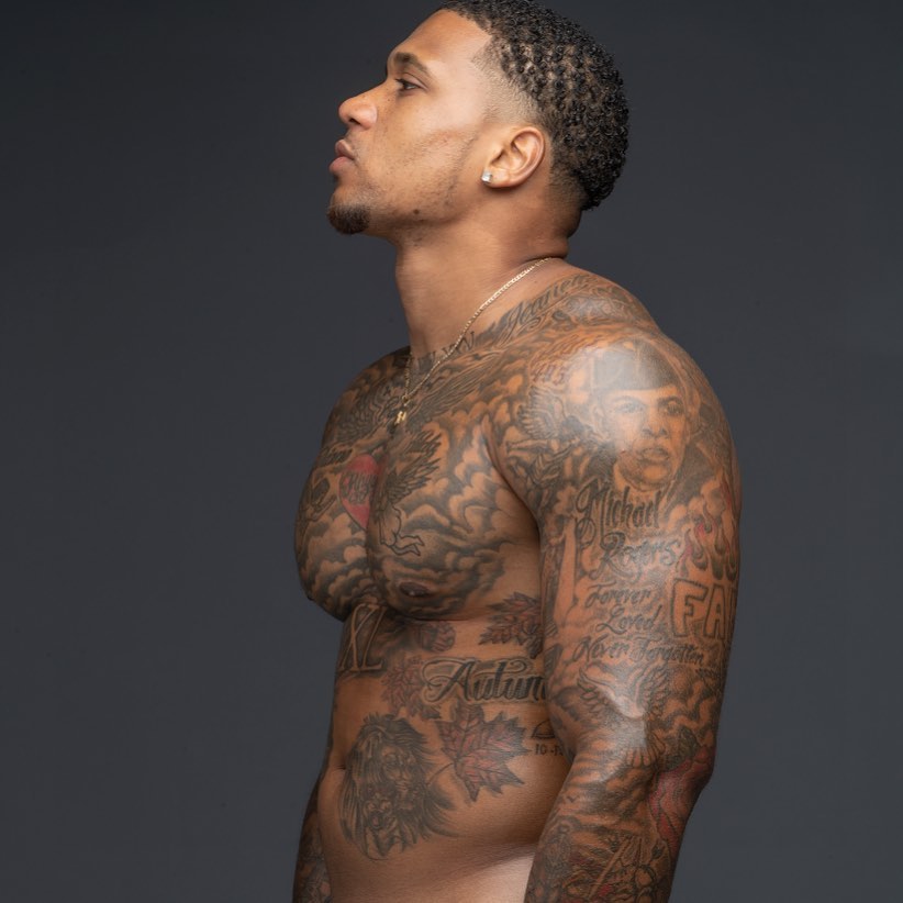 Andre Gray tattoos: side profile chest and arm ink