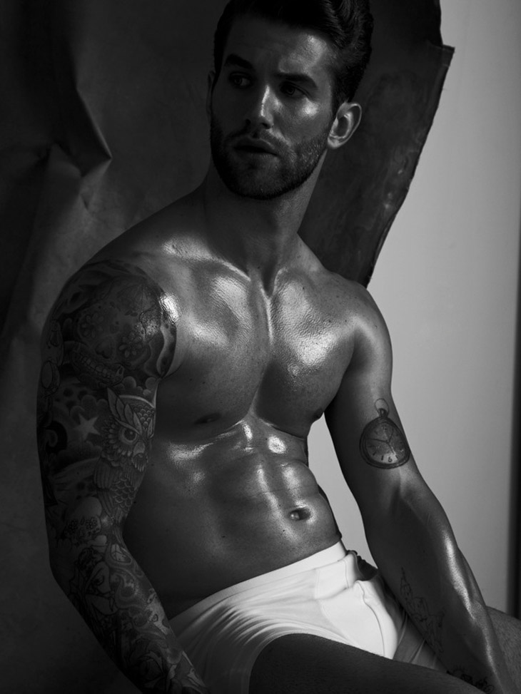 Andre Hamann tattoos: Andre Hamann pocket watch tattoo on his left upper arm