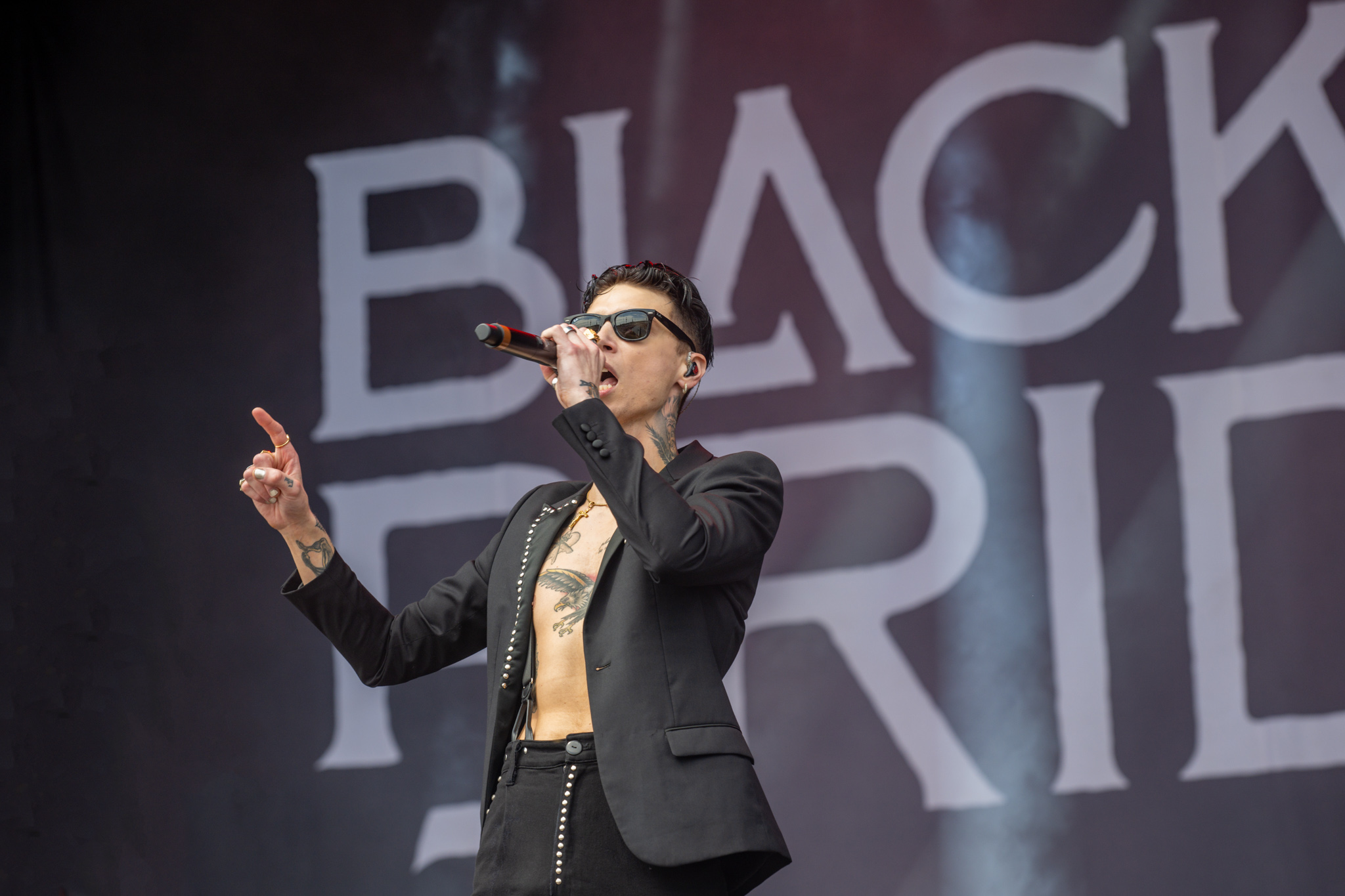 Andy Biersack chest and hand tattoos