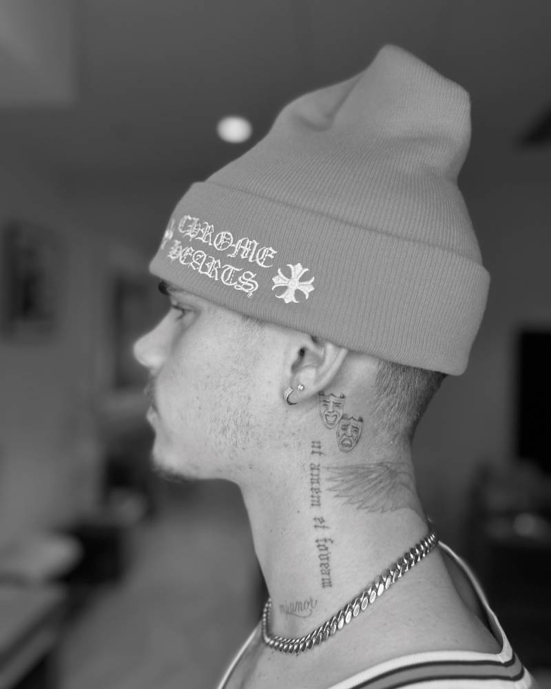 Romeo Beckham neck masks and script tattoos