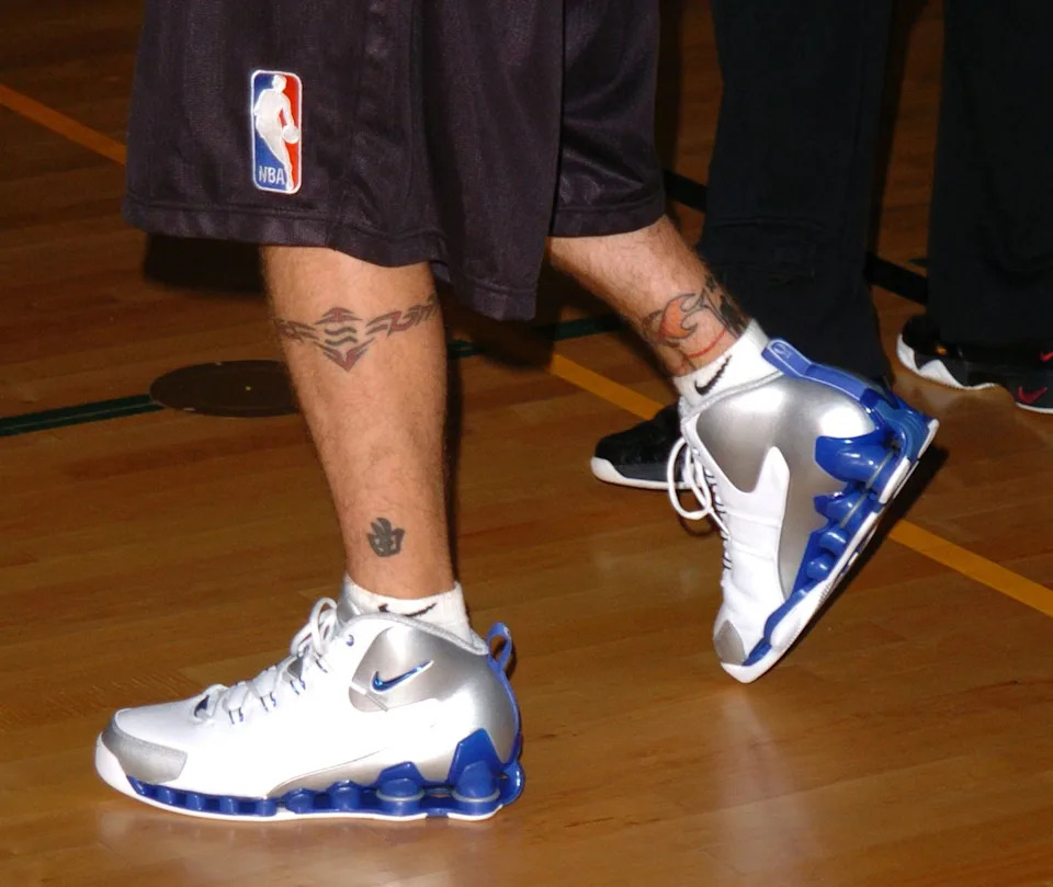 Justin Timberlake tattoos: lower-leg astral band and Chinese music symbol