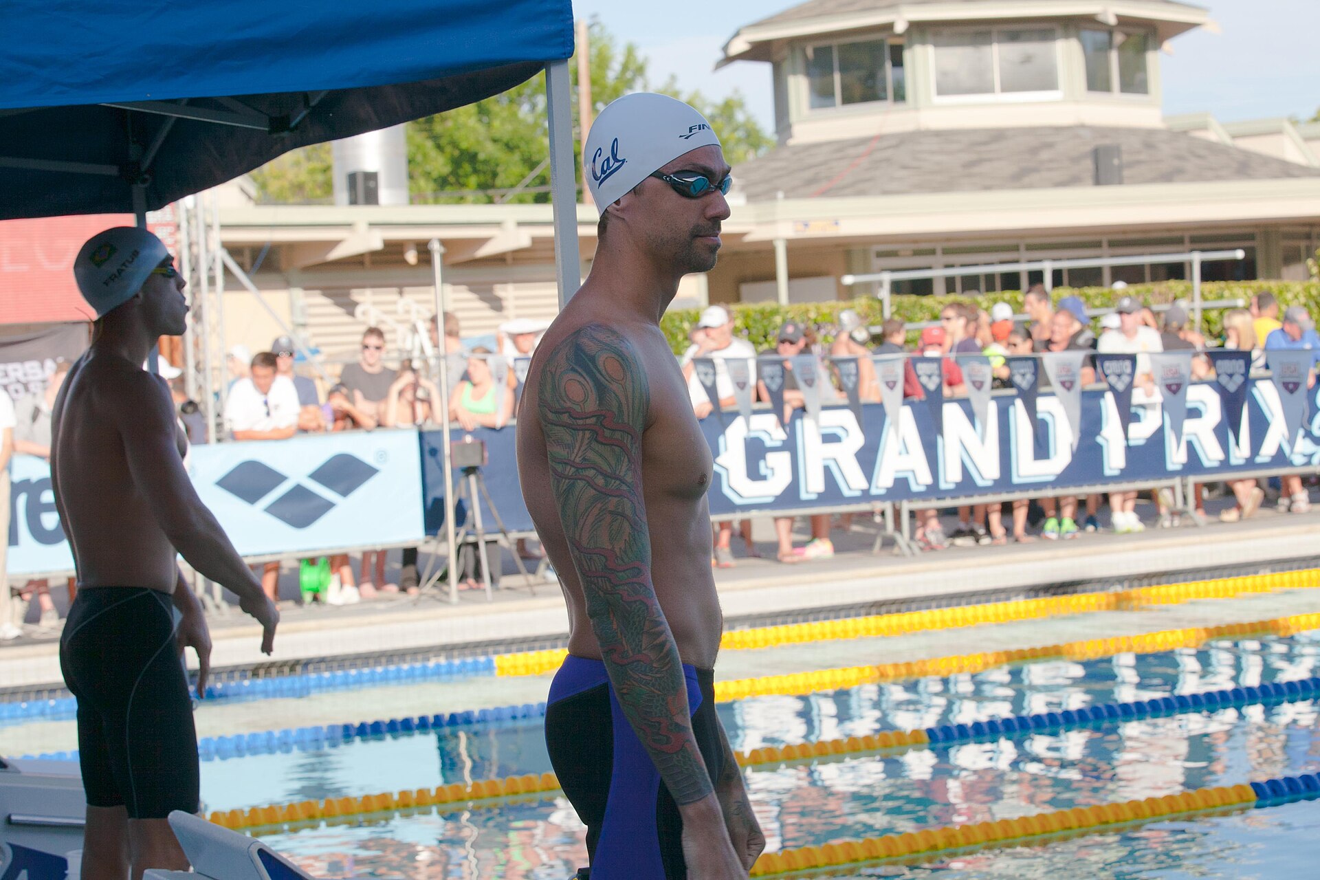 Anthony Ervin tattoos: Tattoo evidence: alternate poolside angle of the shoulder and forearm work.