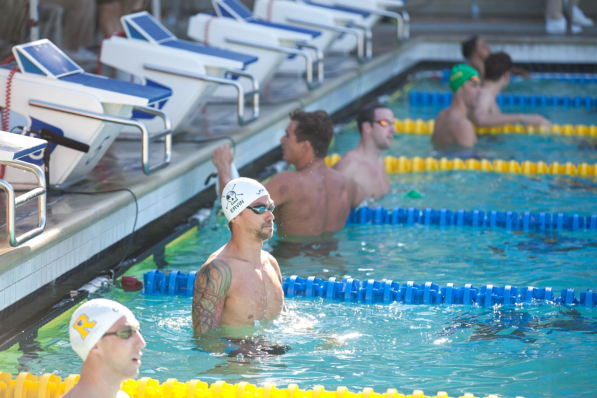 Anthony Ervin tattoos: Tattoo evidence: distinct post-race frame with the sleeve visible in the water.