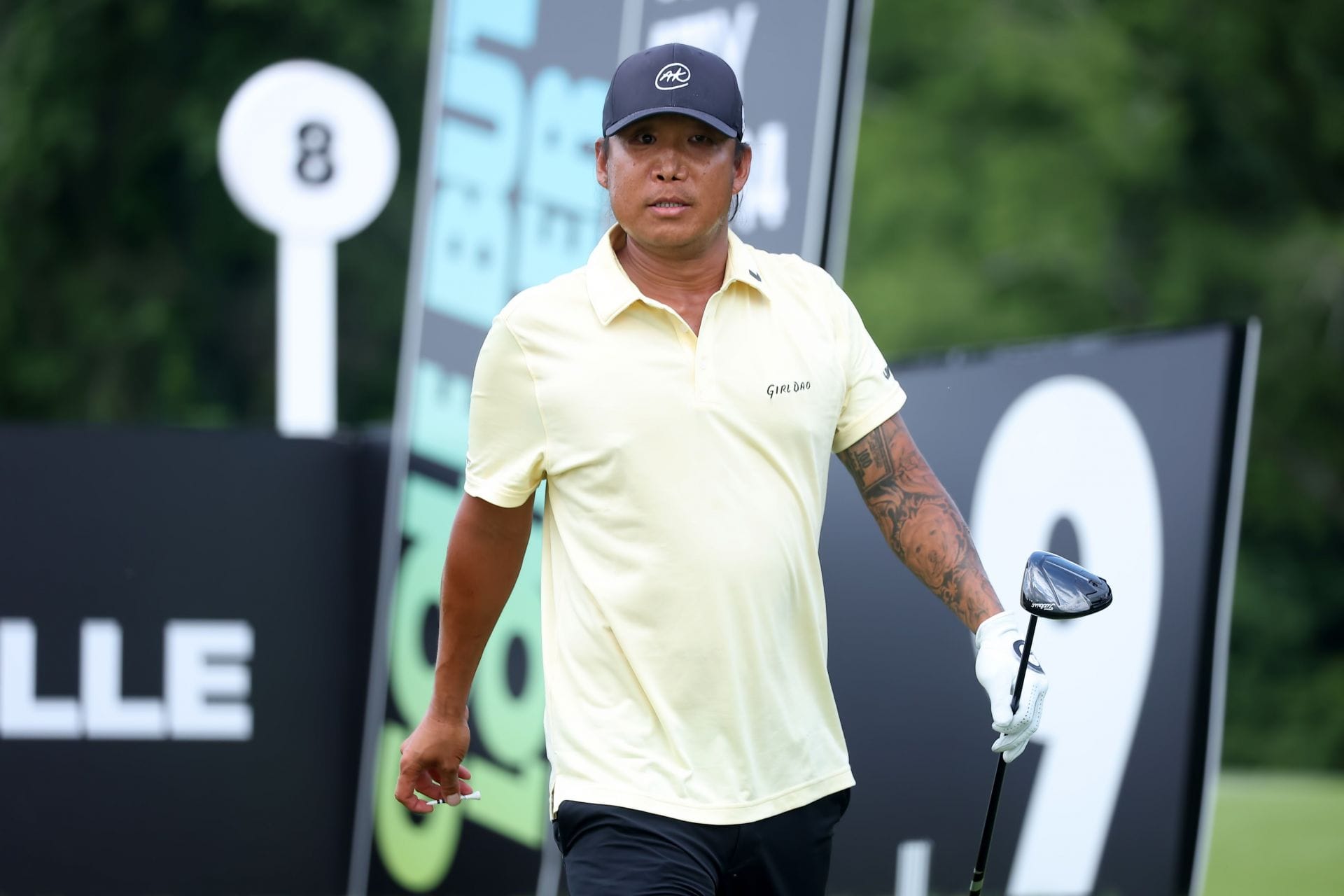 Anthony Kim tattoos: black and grey sleeve visible on the fairway