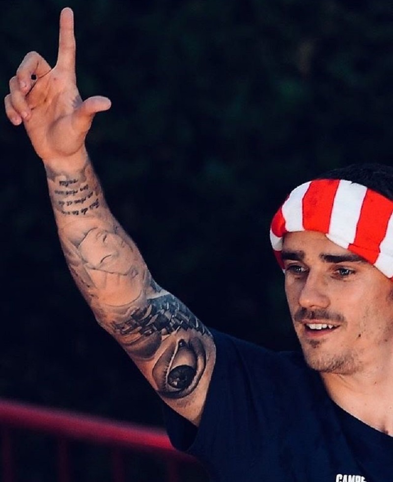 Antoine Griezmann tattoos: Antoine Griezmann hand and wrist tattoo placement with compact lettering