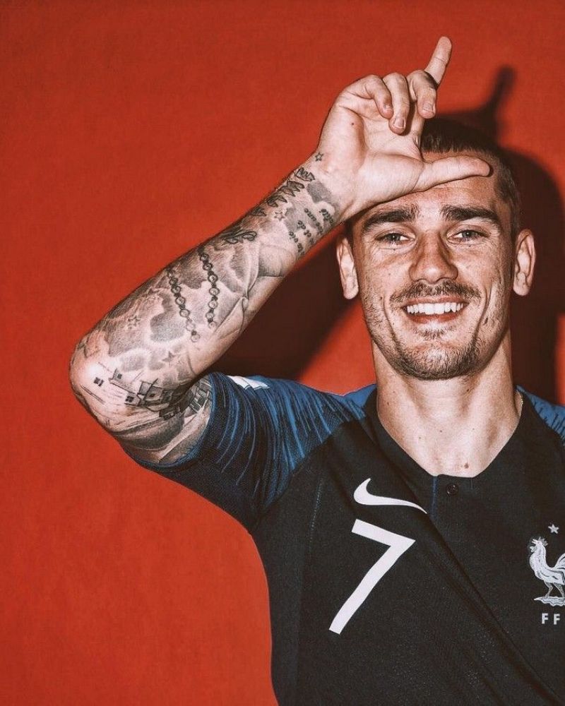 Antoine Griezmann tattoos: Antoine Griezmann full forearm and upper arm tattoo layering