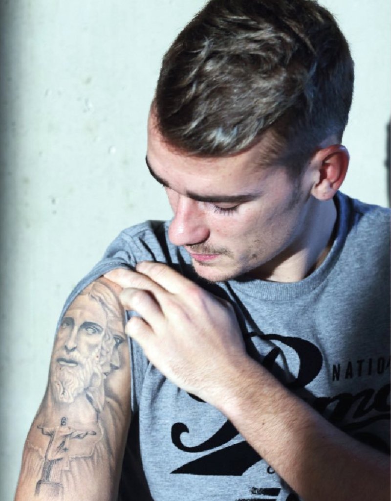 Antoine Griezmann tattoos: Antoine Griezmann close view of portrait tattoo and arm shading