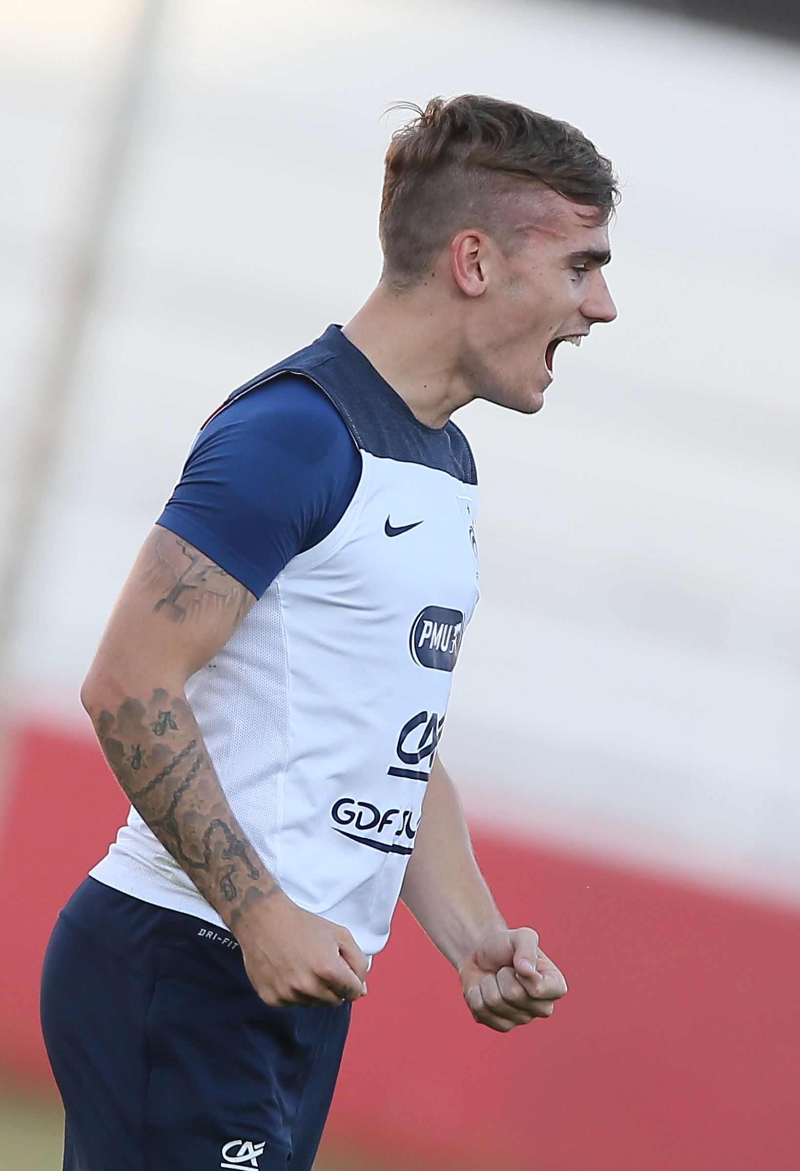 Antoine Griezmann tattoos: Antoine Griezmann religious portrait and forearm tattoo detail