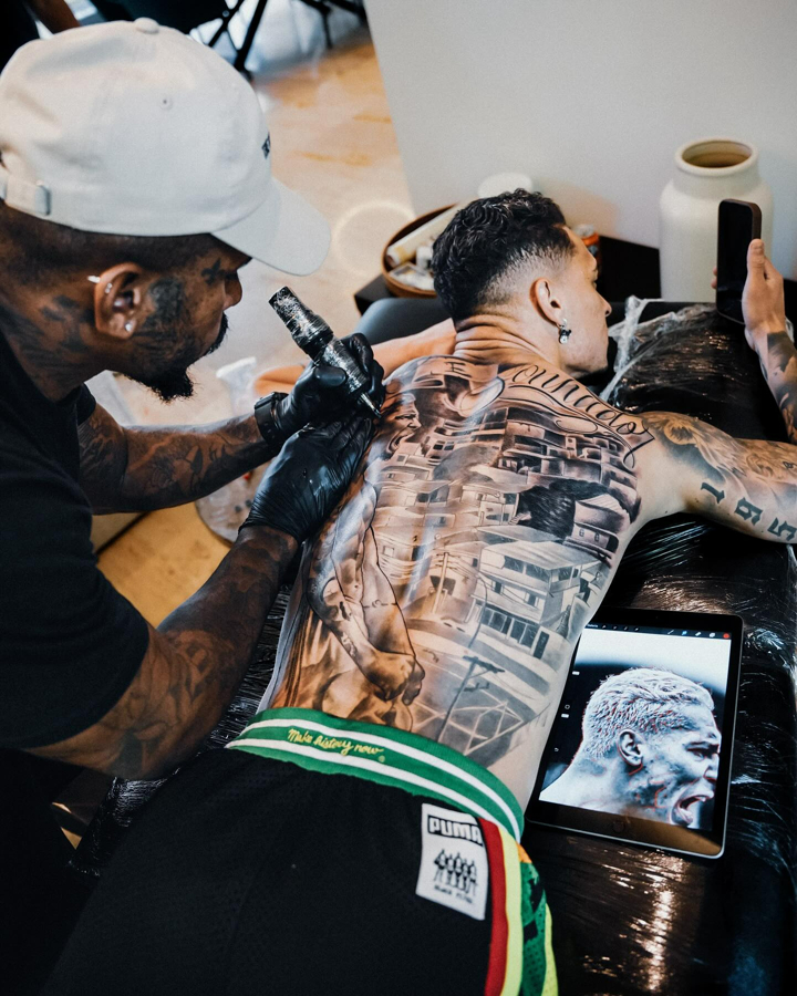 Antony tattoos: clear tattoo-session photograph showing the large back piece