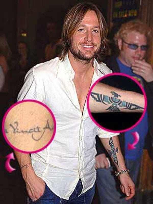 Keith Urban arm tattoos and lettering