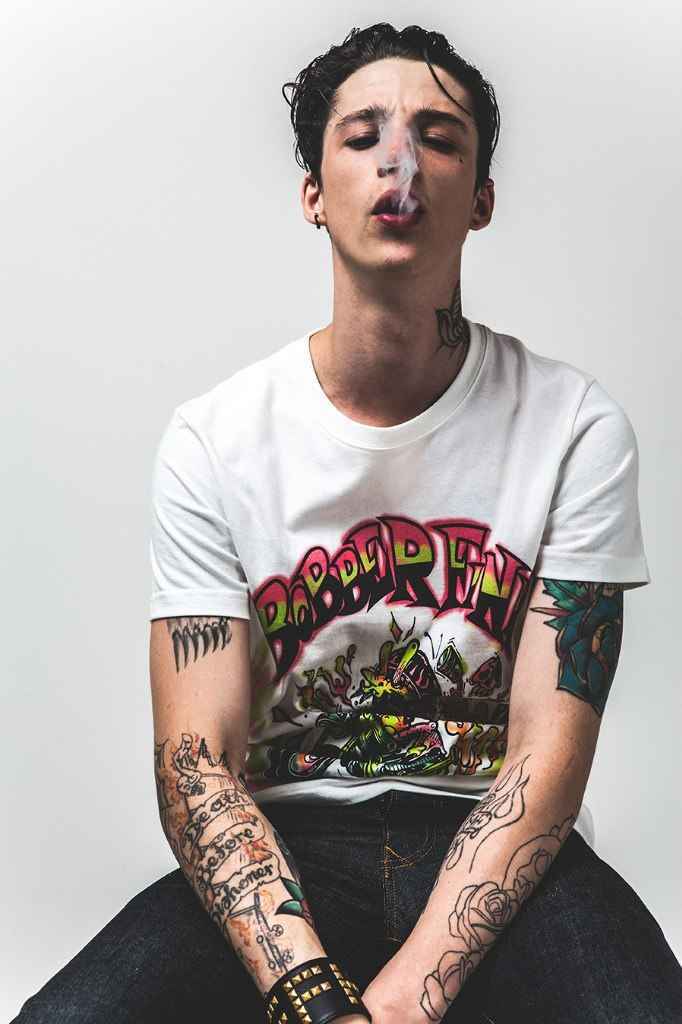 Ash Stymest forearm flaming skull and roses tattoos