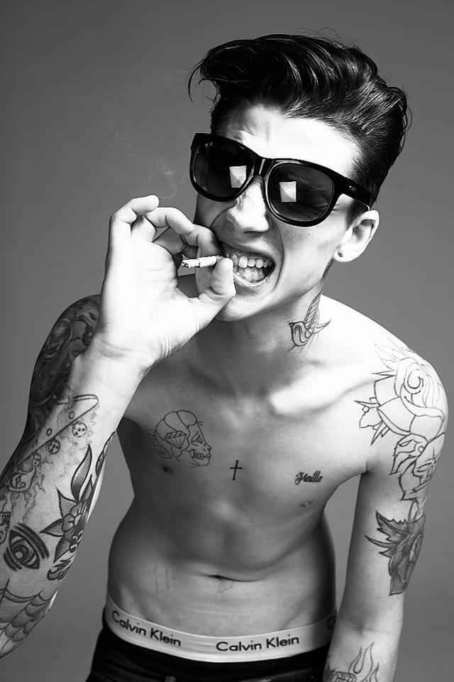 Ash Stymest shoulder roses and skull tattoos