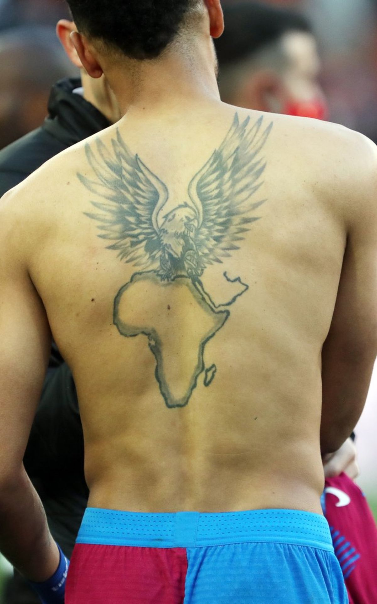 Pierre-Emerick Aubameyang Africa and eagle back tattoo Pierre-Emerick Aubameyang tattoos: The Africa-and-eagle back tattoo