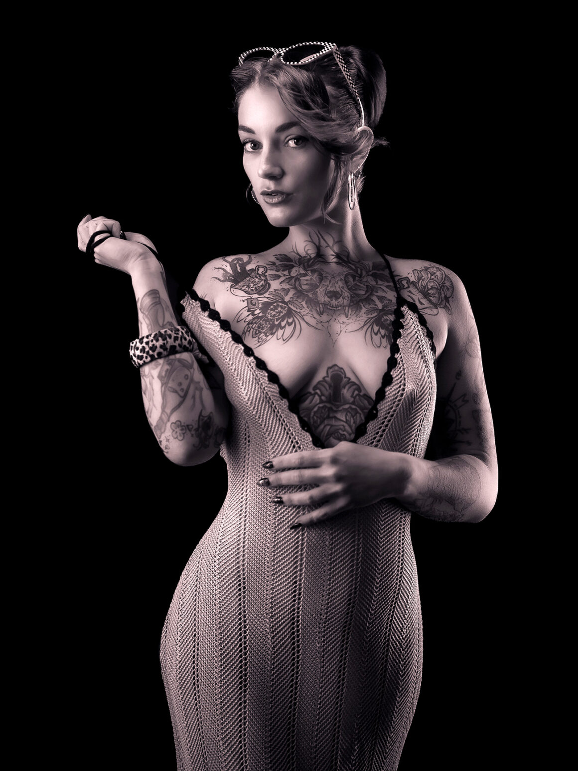 Axelle Fescia tattoos: Show the main illustrated chest composition and the mixed tattoos running down both arms.