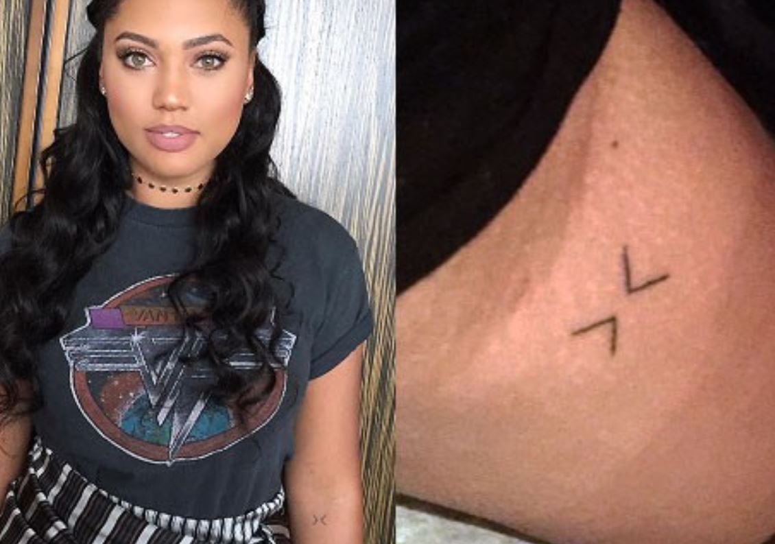 Ayesha Curry tattoos: matching present-moment arm symbol