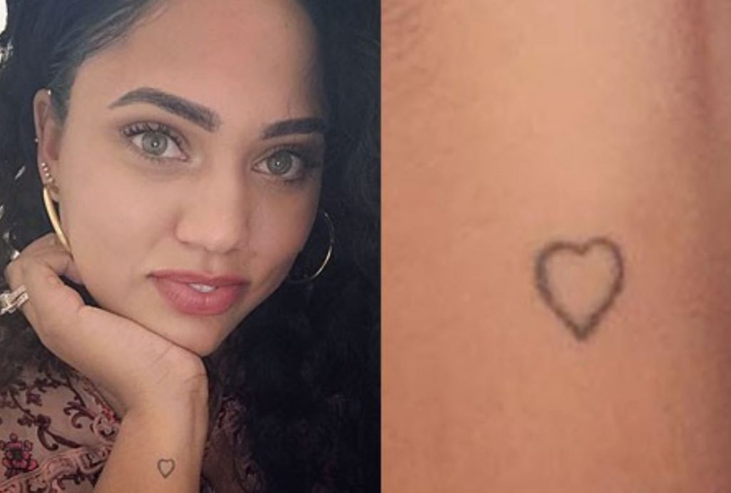 Ayesha Curry tattoos: outlined wrist heart