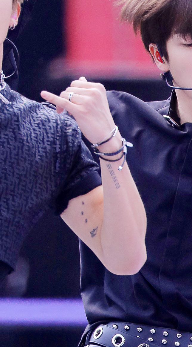 B.I. B.I. performance photograph showing smaller forearm tattoos B.I. tattoos: B.I. performance photograph showing smaller forearm tattoos