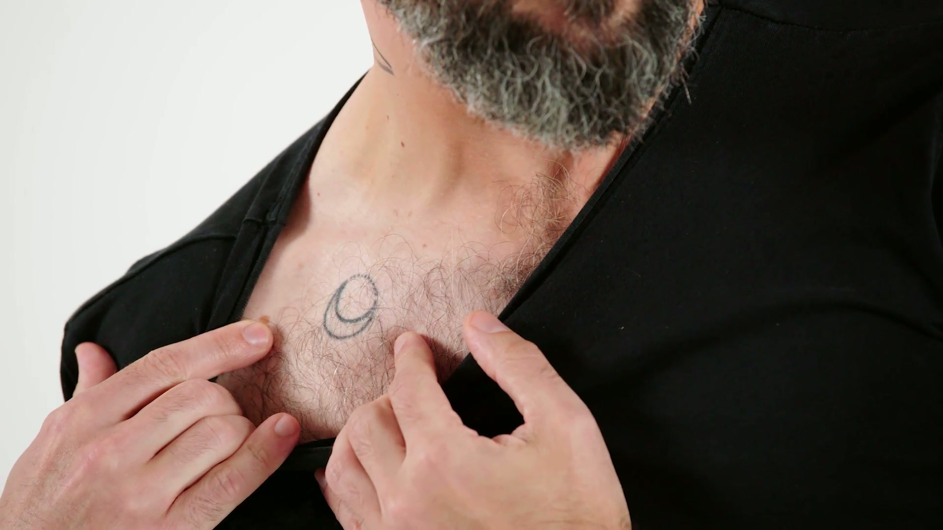 Babish tattoos: close view of the Whole of the Moon crescent on the upper chest