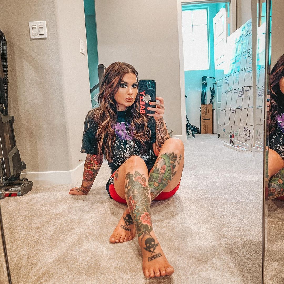 Bailey Sarian tattoos: Bailey Sarian's tattooed legs and arms in a mirror selfie