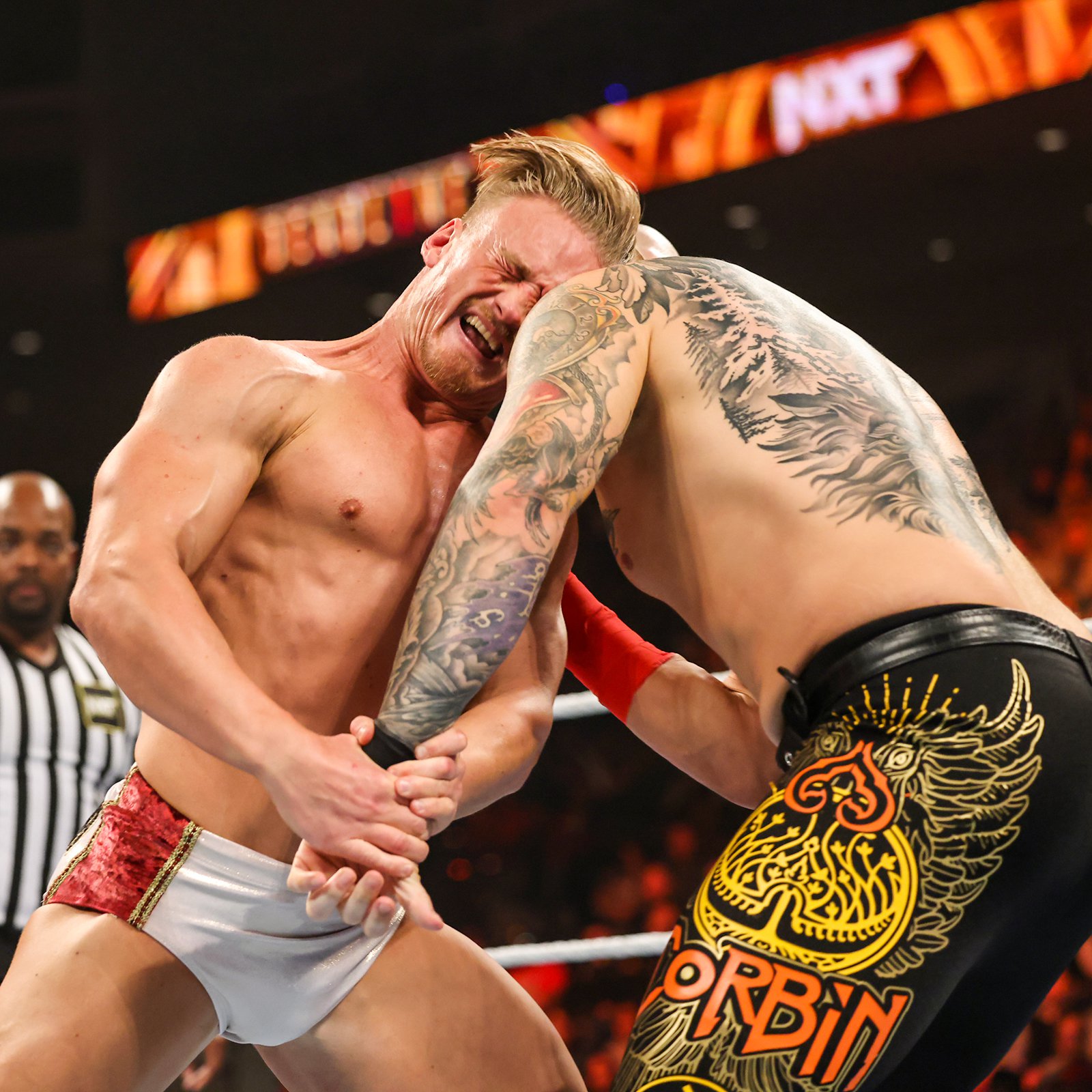 Baron Corbin tattoos: Hourglass and colorful forearm sleeve
