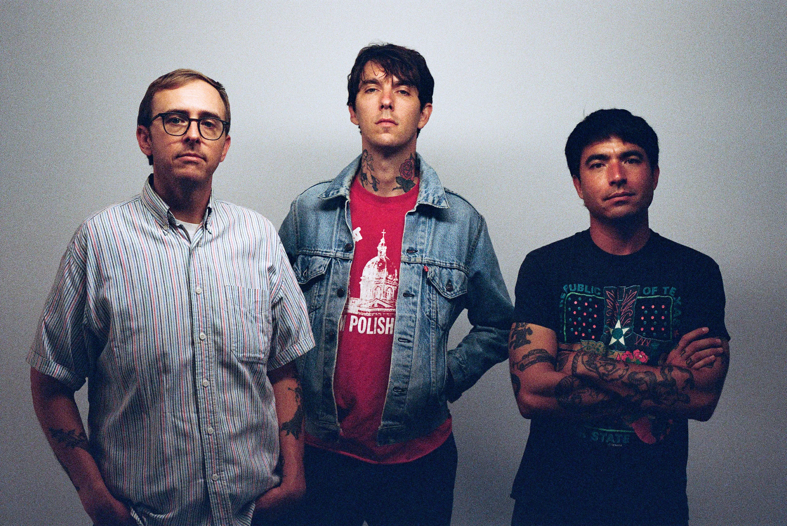 Barry Johnson tattoos: Genuine tattoo photograph showing Barry Johnson's neck and arm ink in a distinct band portrait.
