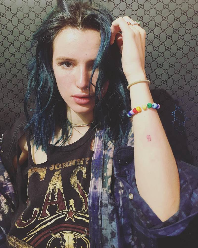 Bella Thorne 93 forearm tattoo