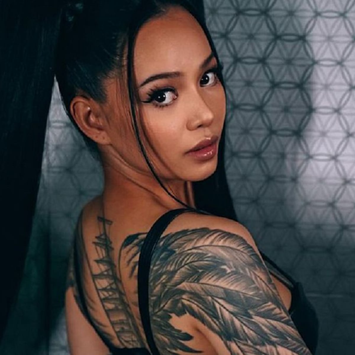 Bella Poarch tattoos: winged ship back tattoo