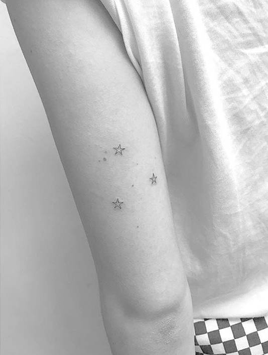 Bella Thorne three stars ankle tattoo