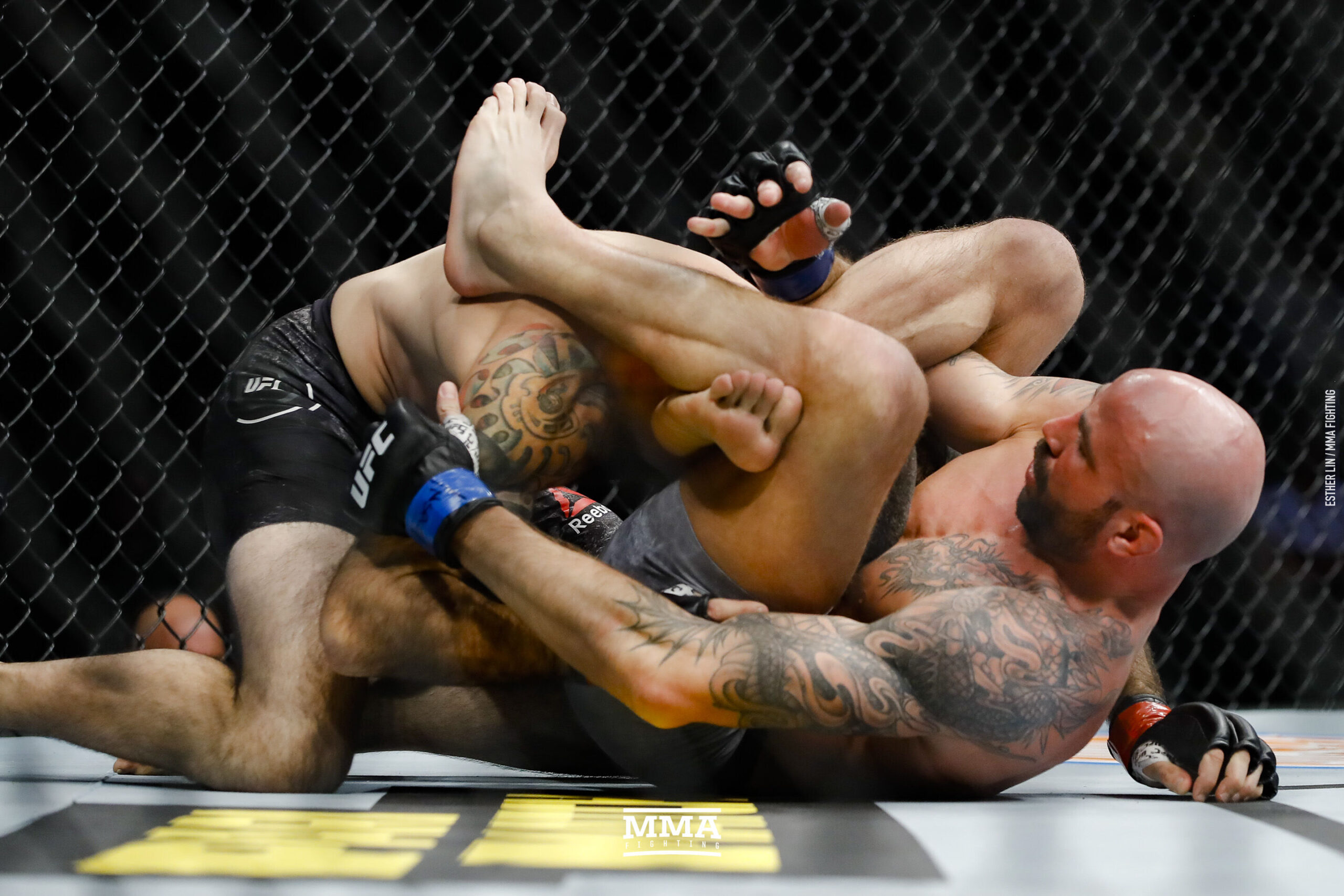 Ben Saunders grappling context at UFC 245 Ben Saunders in a contextual photograph: inline contextual photo, explicitly not tattoo evidence; not tattoo evidence